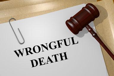 Gavel and 'Wrongful Death' document highlighting damages in Georgia lawsuits.