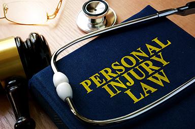 Personal injury law book, stethoscope, and gavel—visualizing Georgia claims and pre-existing conditions.