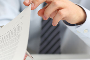 Lawyer reviewing demand letter on desk, highlighting its role in legal claim resolution.