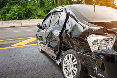Crashed car from Fayetteville truck accident highlights potential liability issues.
