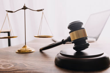 Gavel and justice scales on desk symbolizing Georgia personal injury law basics.