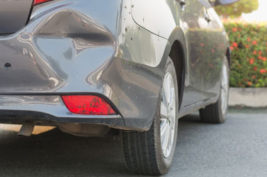 Rear-end damage on gray car from hit-and-run accident, highlighting Georgia legal recourse.
