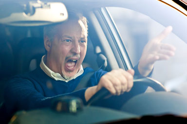 Driver gesturing while driving, illustrating distracted driving risks in Georgia.